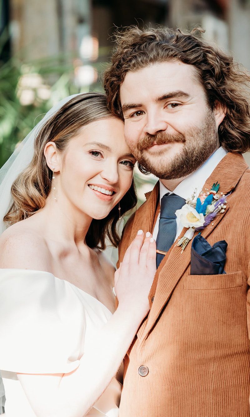 Bride and groom smiling on their wedding day